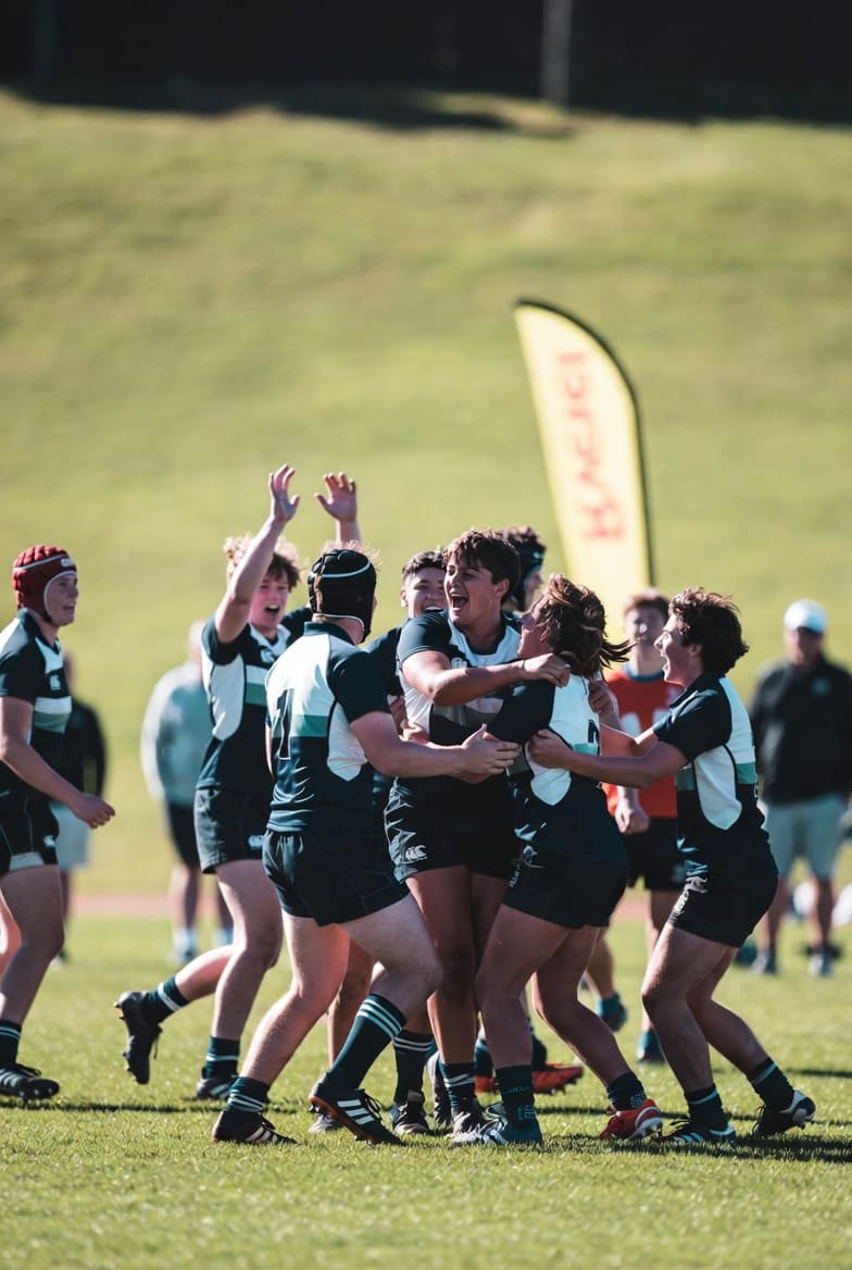 Rugby players competing in a match